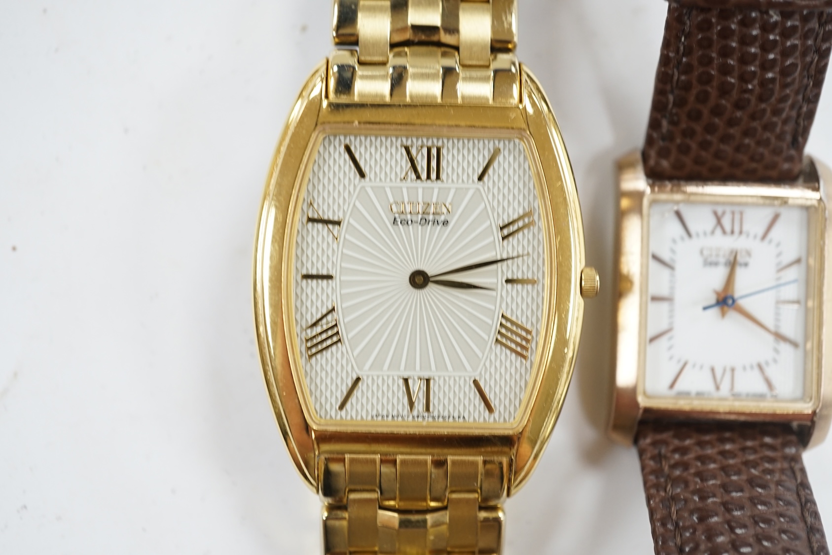 A gentleman's recent gilt metal Citizen Eco-Drive wrist watch and one other Citizen watch. Condition - poor to fair